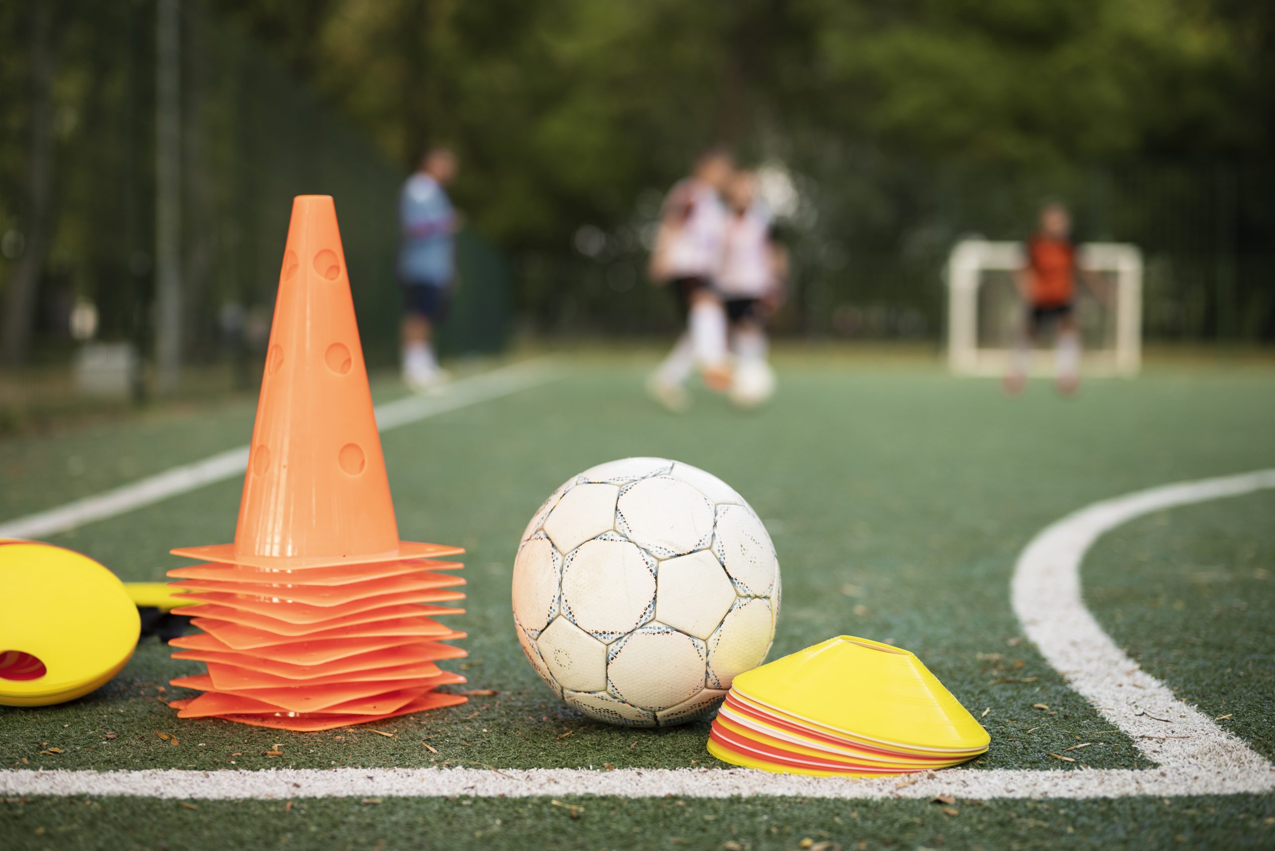 football-trainer-teaching-his-pupils