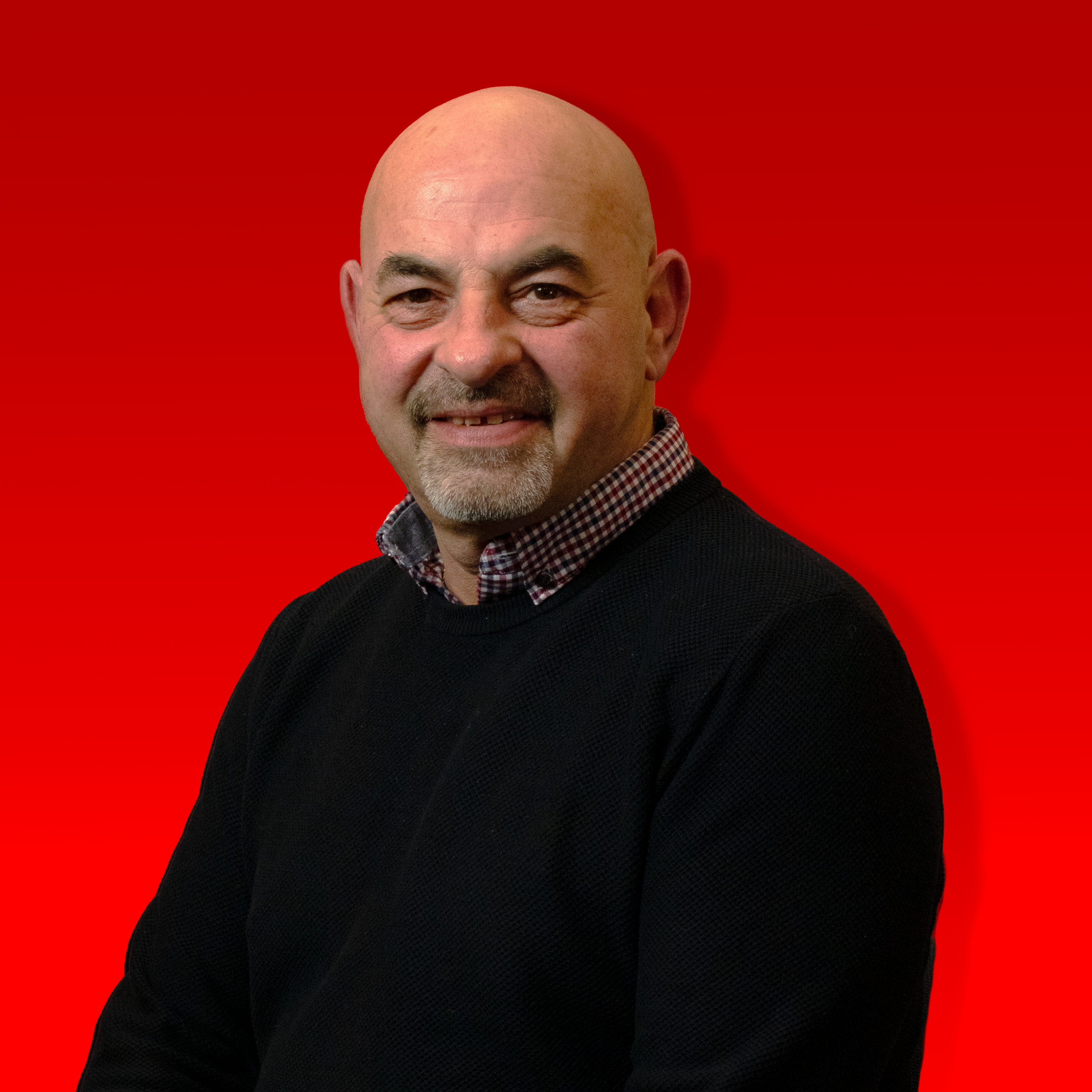 Dino Iandico - Sat down with black knit jumper on smiling